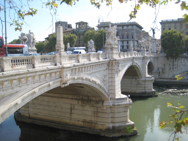 Ponte Vittorio Emanuelle White marble-looking bridge with lots of statues.