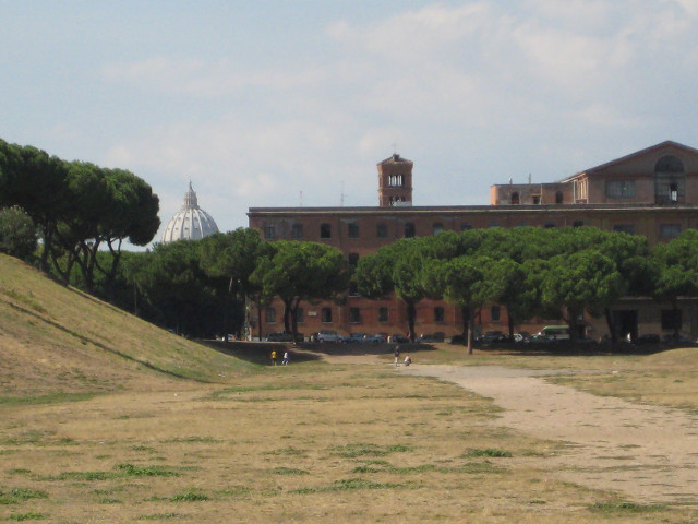 Circus Maximus, St Peter's dome in distance. grassy field