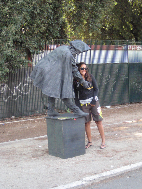 "got me a date with Boticelli's niece." girl clowning lasciviously with statue-mime