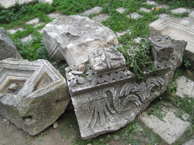 on the cover of the roman stones fragments of carved Roman frieze or lintel