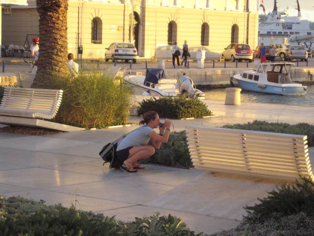 seeing and recording teenage girl squatting to photograph friend