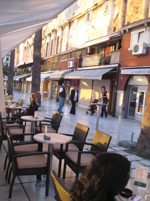 The Riva, Caligari-view cafe tables and storefronts