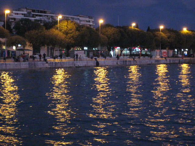 Evening view from the Riva lights reflectiing on harbor water