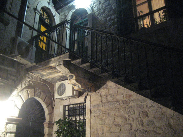 coming home at night stone stairs and porch light