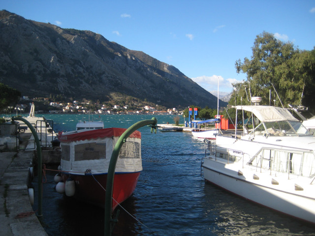 harbor yachts, mountains in background