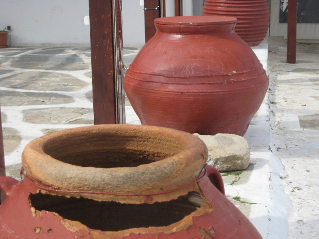 defaulttitle worn urns along edge of small square