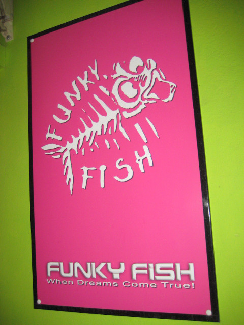 Not an eatery, fortunately Sign "Funky Fish", logo of fish skeleton