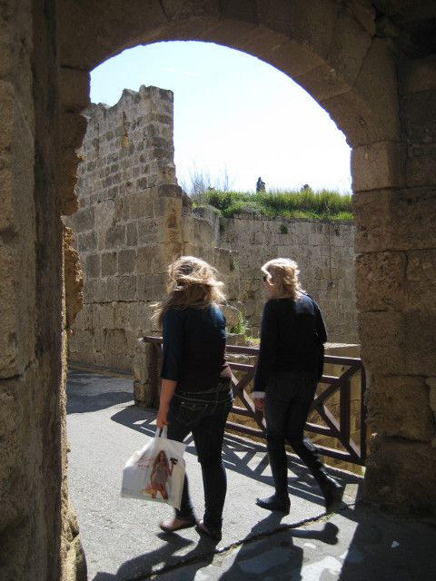 I'm not a Croc two people crossing the moat on a former drawbridge