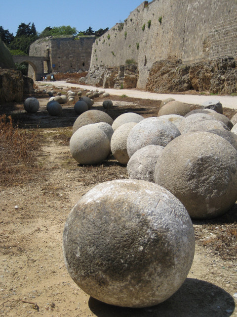 Ball A dozen or so tone spheres, ~2ft diameter, lying on the ground