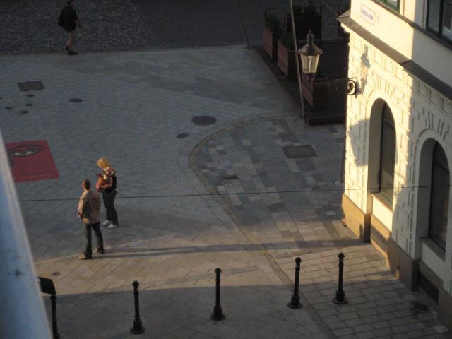 The dawn's early light Bird's eye view: shaft of early sunlight on two pedestrians
