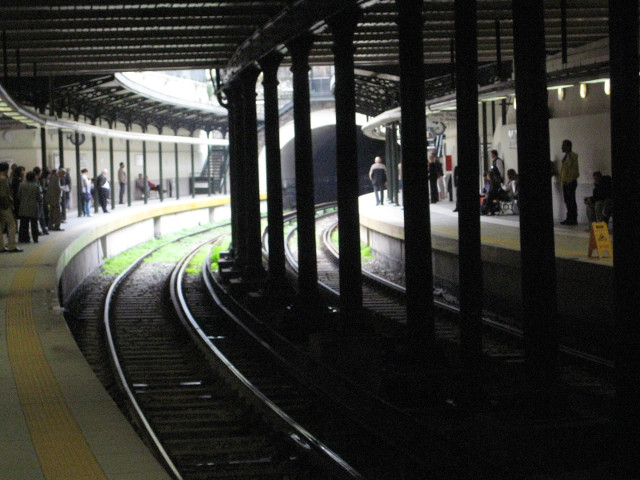 Monastiraki - toward Pireaus Tracks curving away from an open-roofed platform.