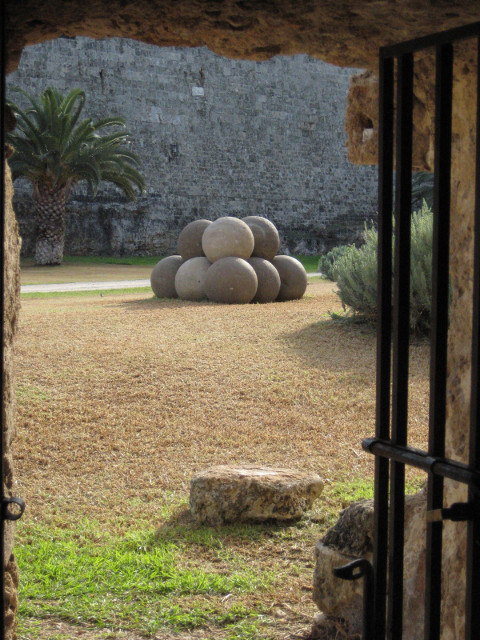 Door from the Moat stack of stone balls, through stone door frame.