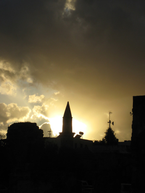 November Sundown Skyline silhouetted against setting sun and storm clouds