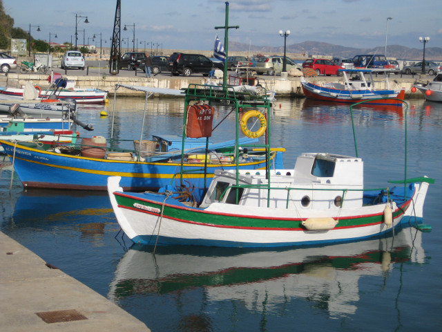 small boat small boat with reflection in water