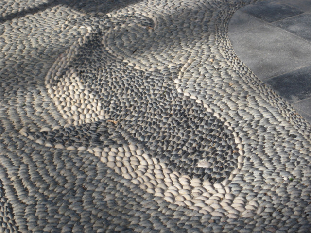 Porpoise Mosiac Porpoise mosaic on black and white sea pebbles in sidewalk