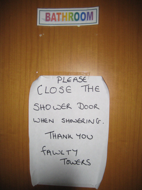 Fawlty Towers sign: please close shower door when showering