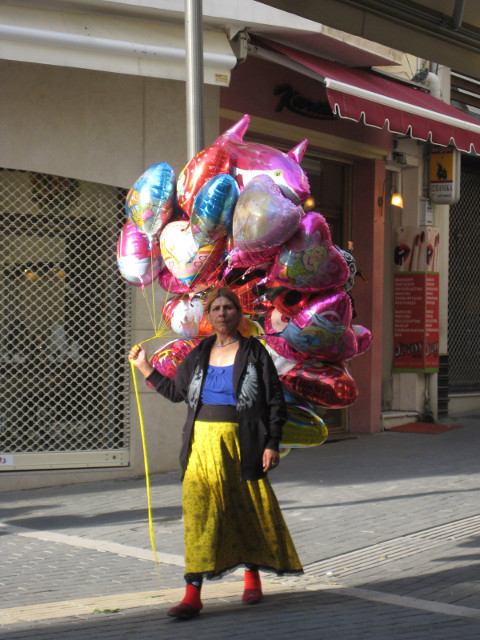 Gypsy Balloons gypsy woman selling metallic helium balloons