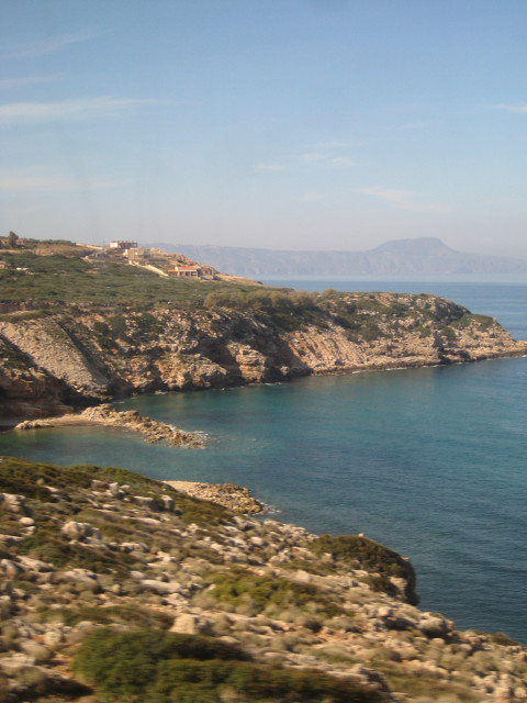 On the Bus Cretan coastline through bus window.