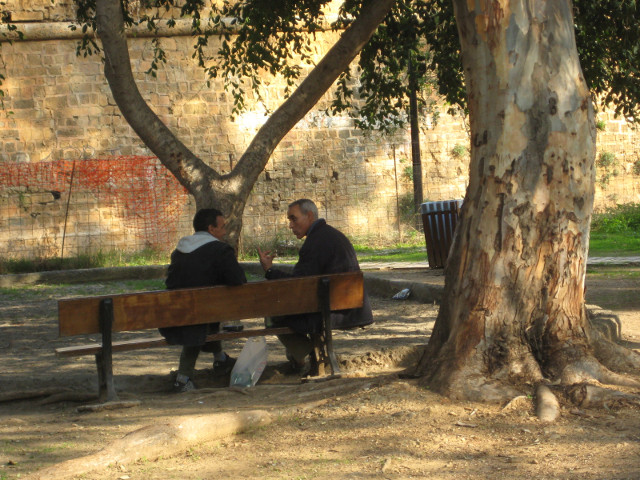 Discussion two guys on a park bench talking