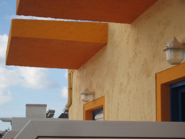 Balcony Roofs Orange slabs over guestroom balconies