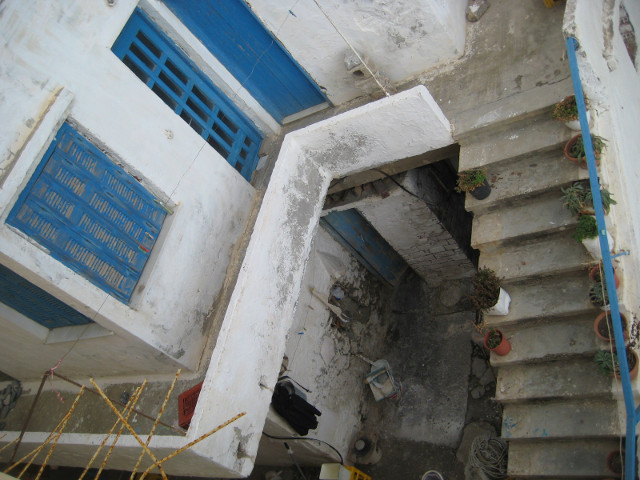 Dead Yard view down from balcony into apparently abonded courtyard