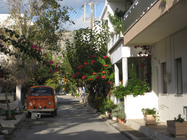 Back Street street with whitewashed buildings andd bougainvilla