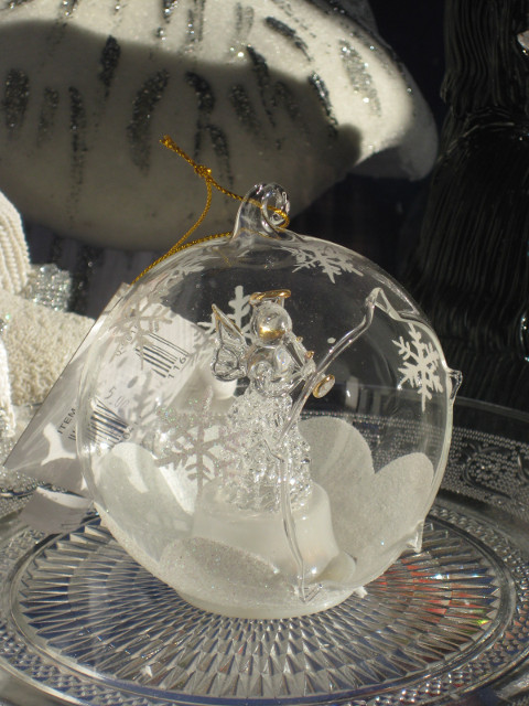 Snowy Sphere blown glass snow scene in sphere in shop window