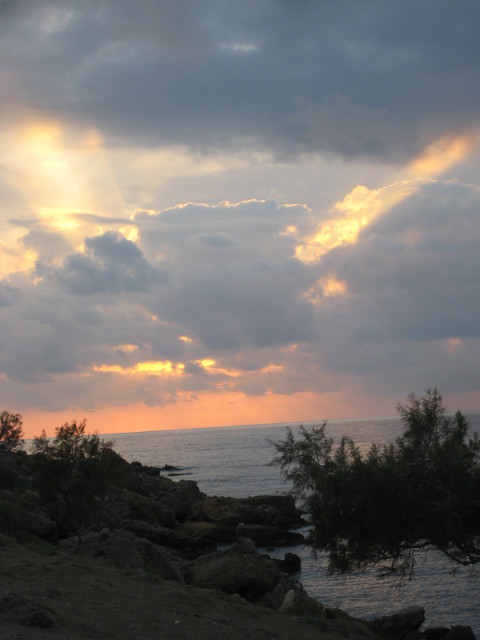 Sunset sunset behind incoming storm clouds