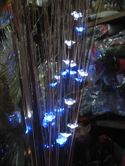Blue Light Rain reeds with blue and white lights in shop display