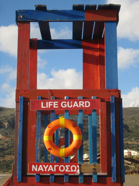 Off-season color brightly-painted lifeguard chair, vacant