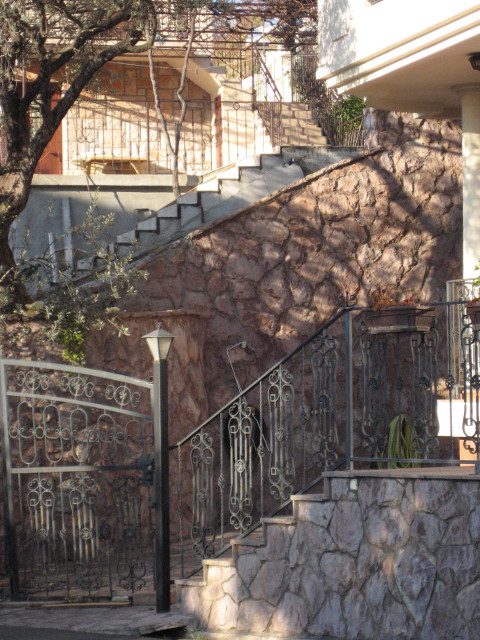 afternoon near Sveti Stefan sun and shadows on several stairs