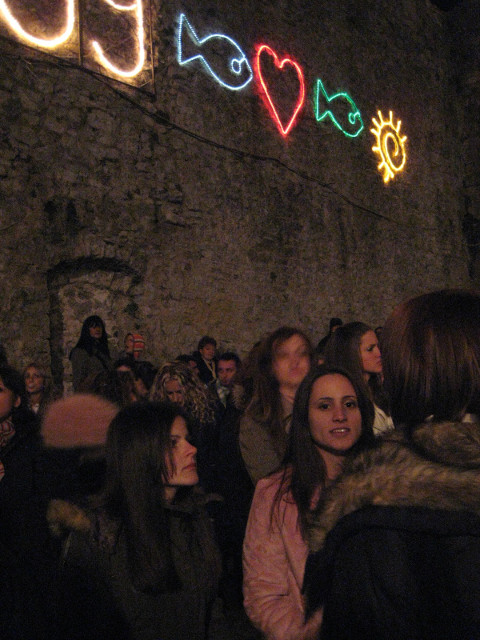 Near trhe front on "Keith's side" young women inder lights on wall