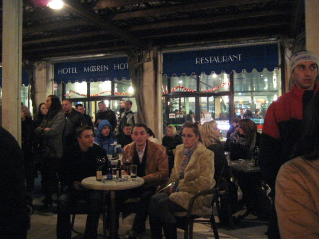 cafe-side seats people watching from cafe tables