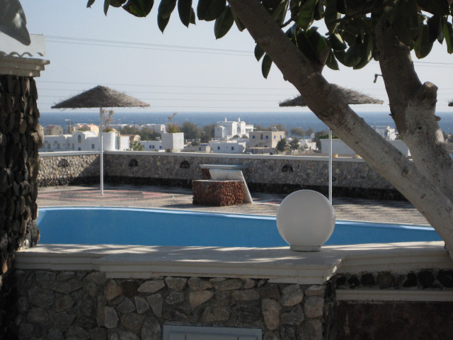pool needs cleaning, ocean does not pool terrace, beachfront bldgs in distance