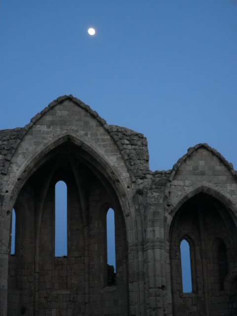 Old Church With Moon waxing moon over shell of tall gothic archway