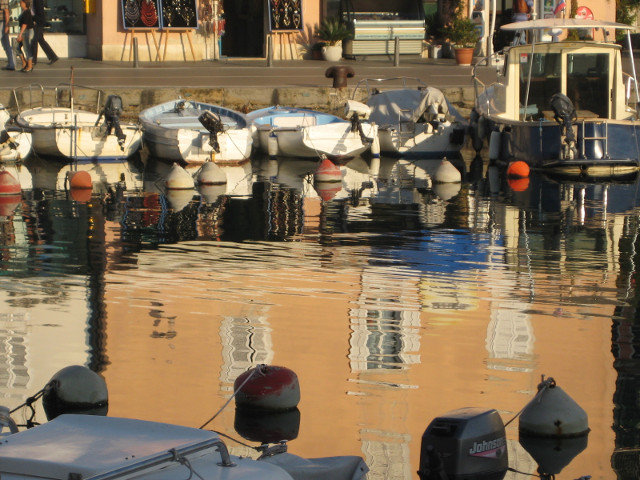 Piran Reflection Tan colored building reflected in inner harbor