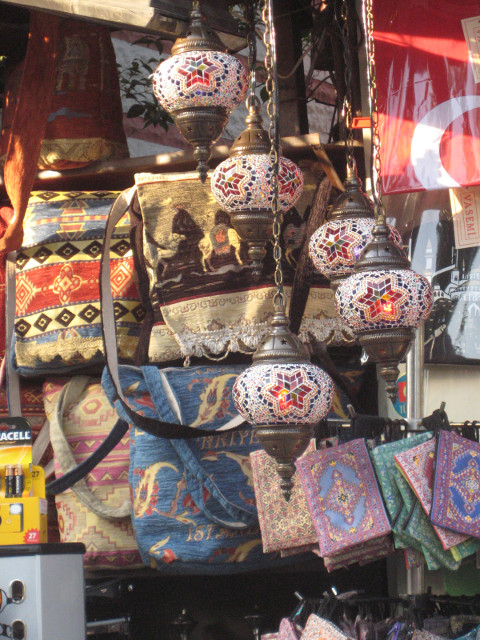 Lamps and Handbags Colorful shop window with touristy hanging lamps