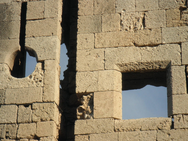 Holey Wall square hole and round hole in stone wall