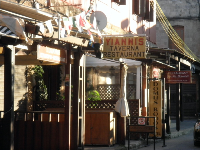 Yiannis line of shop fronts, including Yannis Taverna