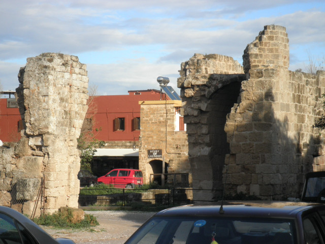 Early christian Basilica shopping street frammed by sides of ruined archway