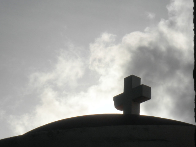 Cross, Pre-Rain silhouette of cross on a dome against rain clouds