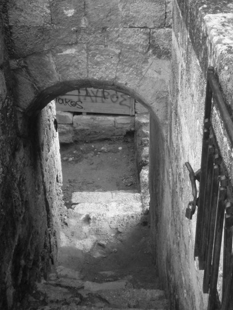 Moat Entrance stone stairs descending through arch