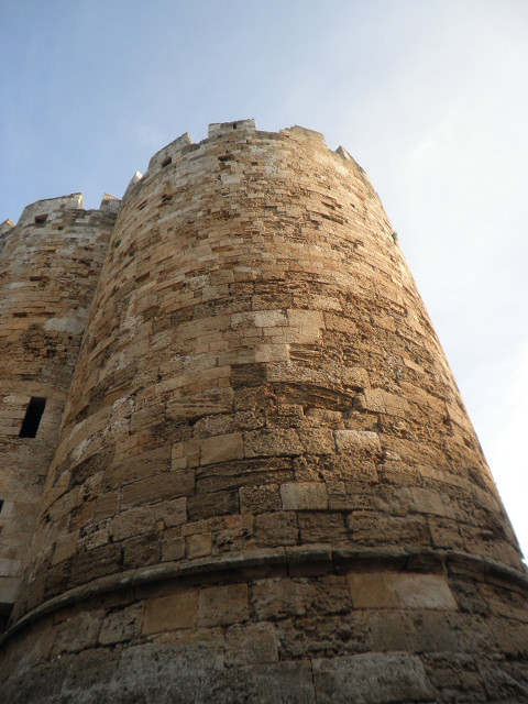 Watchtower worm's-eeye-view of round crenellated stone tower