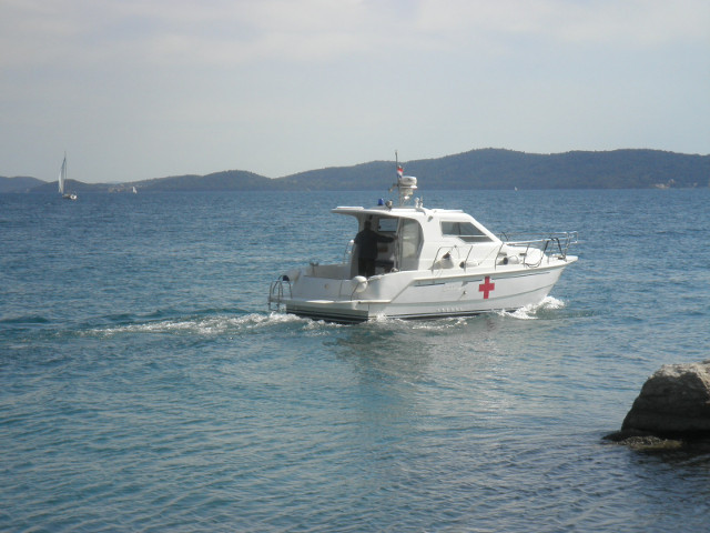 yacht and island small motor yacht, island in distance