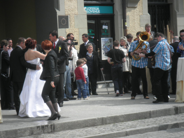 Committing Holy Matrimony wedding party outside town hall