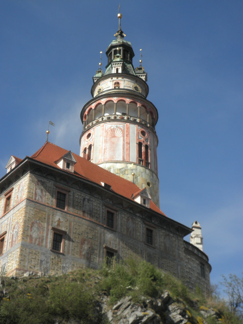 Krumlov - Castle Tower worm's-eye view of brightly-decorated round tower