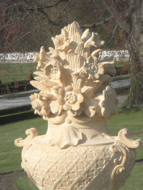 In lieu of trees flowery-carved vase statue