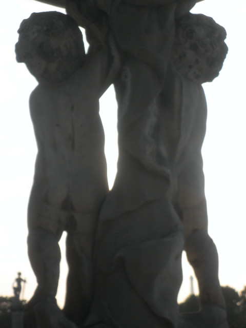 Cupids or Such silhouette -two stone figures holding up something (fountain?)
