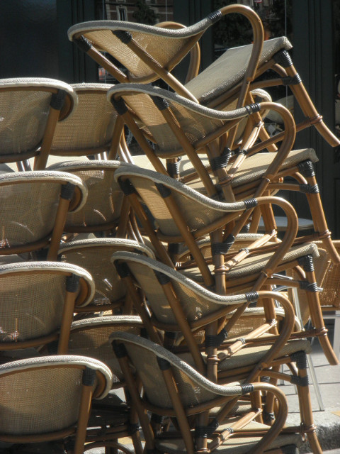Rouen - Cafe Chairs side-lighted stack of wicker chairs