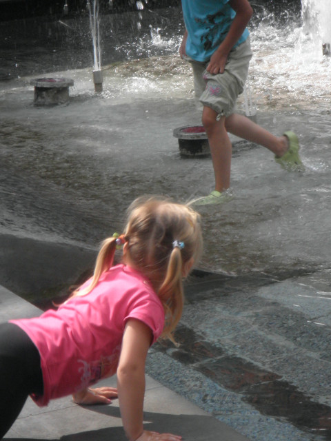 Košice - Fountain Girl young girl leaning over public fountain